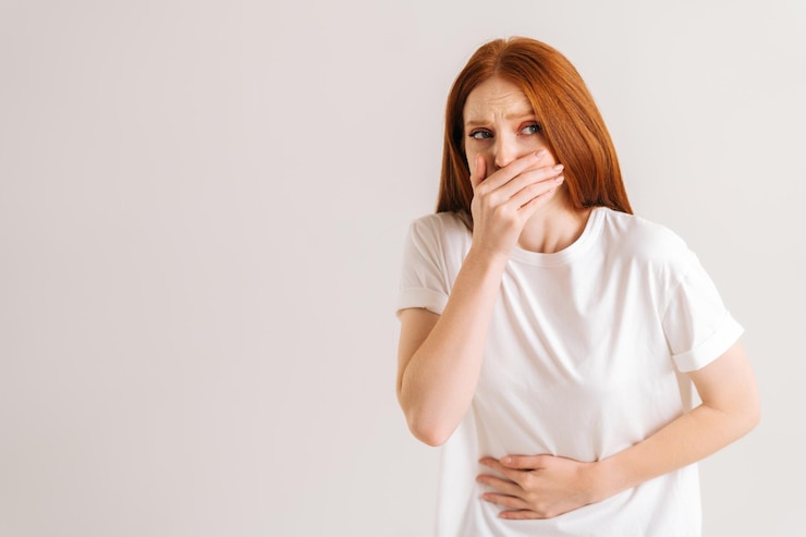 Photo portrait of unwell young woman feeling painful cramp in stomach grimacing and writhing in pain