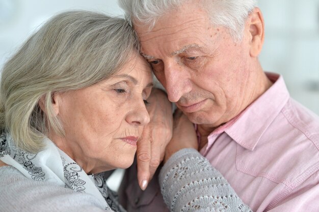 Portrait of a upset mature couple, close up