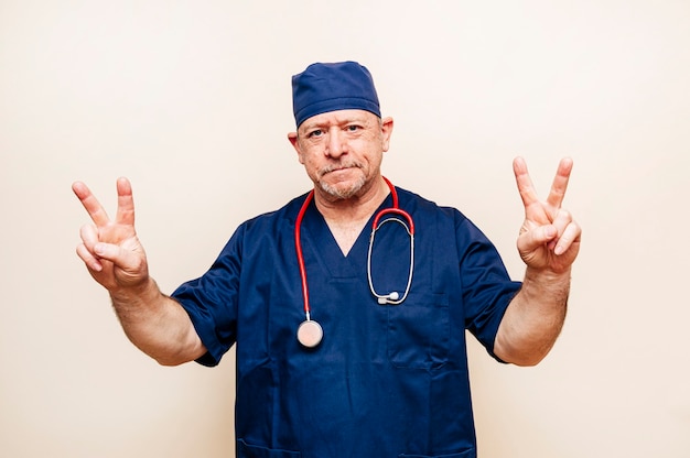  portrait of a veteran doctor in an operating room suit