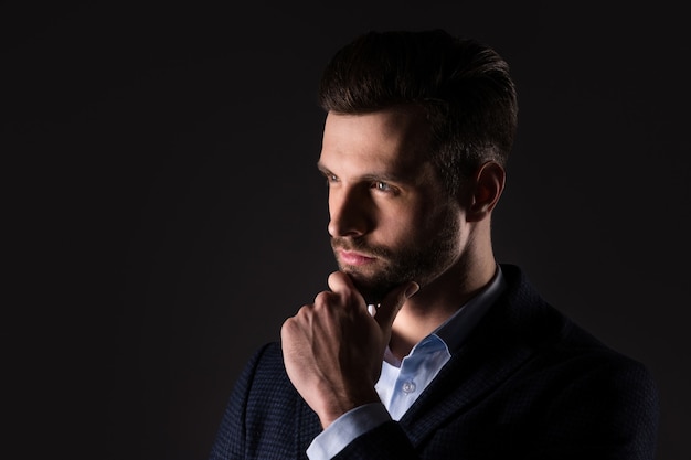 portrait of virile smart clever minded guy planning career growth strategy