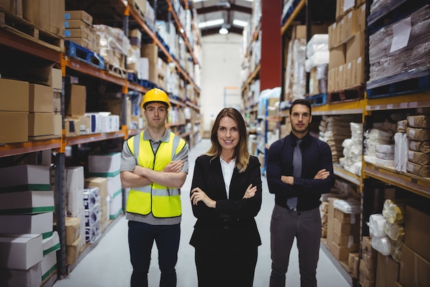 Portrait of warehouse manager and workers in warehouse