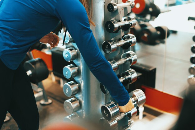 Portrait of weights in a gym during day time, morning sport routine