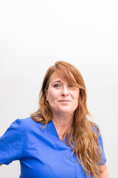 Portrait of a white dentist woman posing at the dental clinic hall