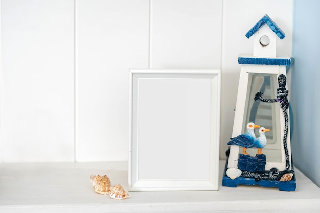 Portrait white picture frame mockup with sea decorations