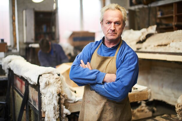 Portrait of the wizard in workshop for making glass