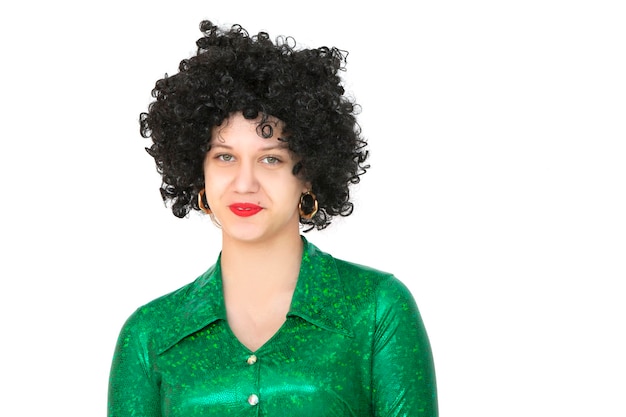 Portrait of a woman in an afro wig on a white background Disco girl