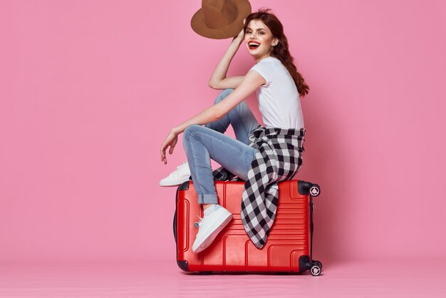 Portrait of woman against pink background