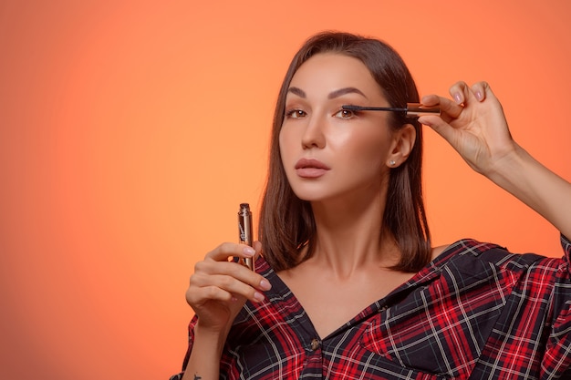 portrait woman applying make up