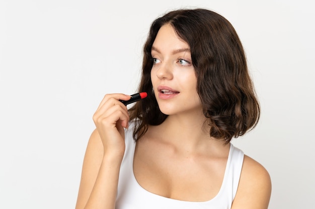 portrait woman applying make up