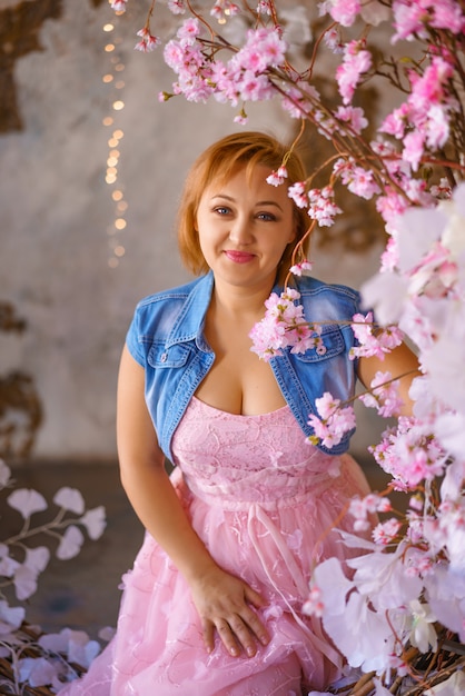 Portrait of a woman on a background of flowers