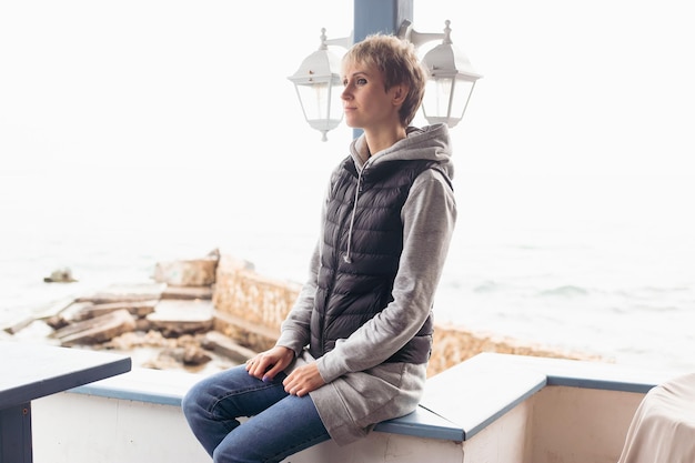 Portrait of woman on beach near sea closeup