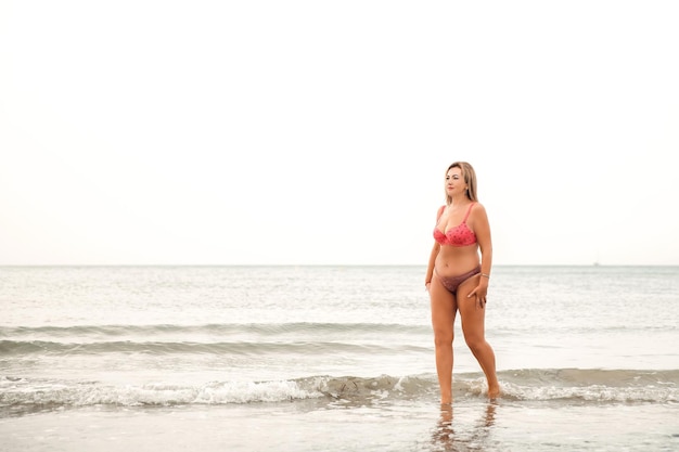 Portrait of a woman on the beach ocean unity with nature healthy lifestyle