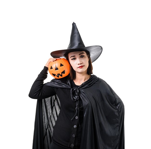 Portrait of woman in black Scary witch halloween costume standing with hat isolated white 