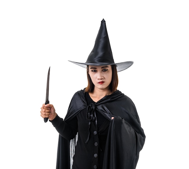 Portrait of woman in black Scary witch halloween costume standing with hat standing isolat