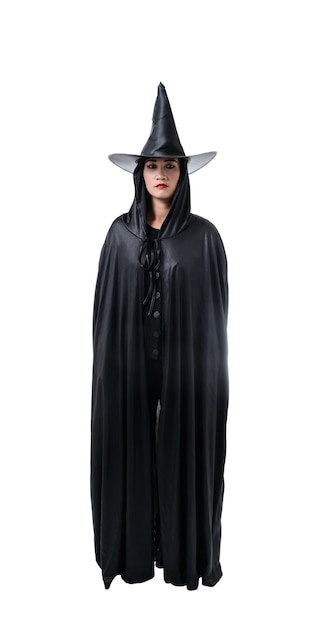 Portrait of woman in black Scary witch halloween costume standing with hat