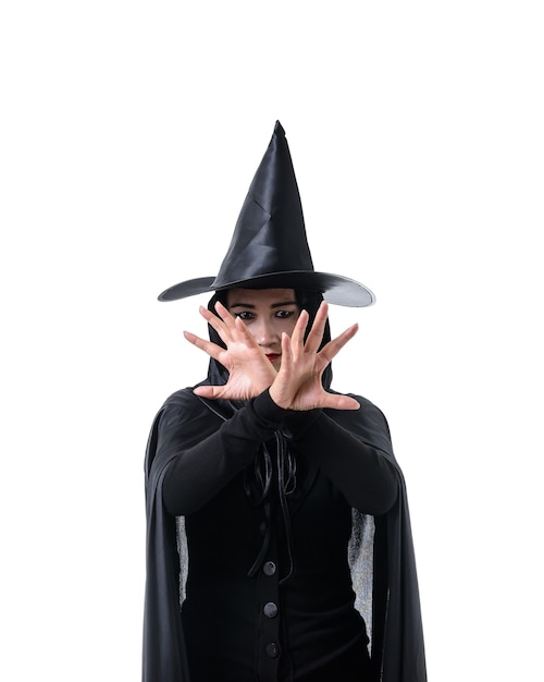 Portrait of woman in black Scary witch halloween costume standing with hat 