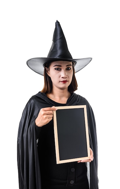 Photo portrait of woman in black scary witch halloween costume standing with hat