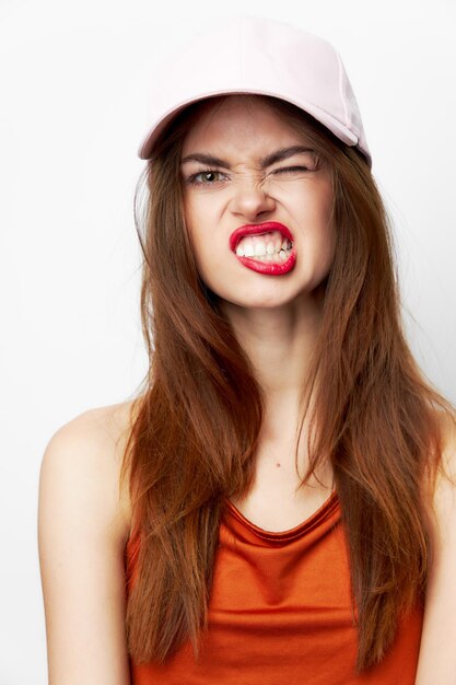 Portrait of a woman in a cap Cheeky look grimace model attractive look closeup