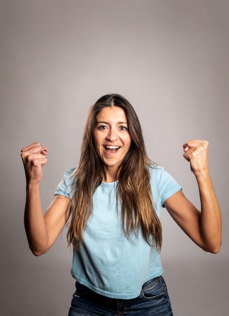 Portrait of a woman celebrating being a winner