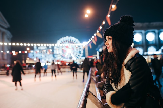 portrait woman at a Christmas market decorated with lanterns