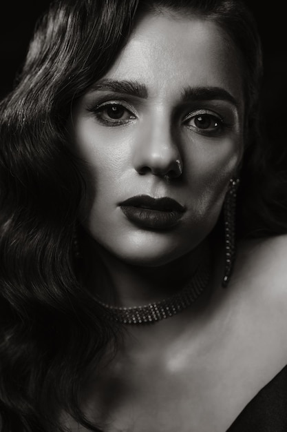 Portrait of a woman in a classic vintage noir image Photo of a girl in retro style