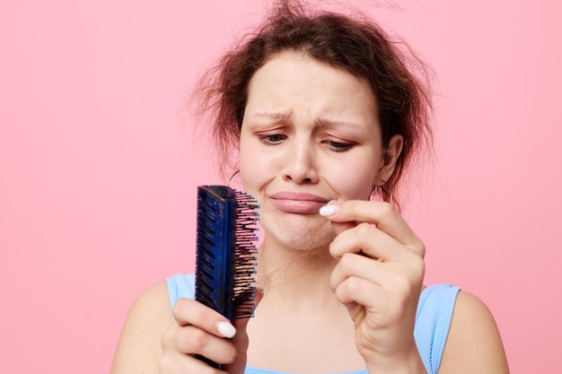 Photo portrait of a woman comb hair disgust hair loss lifestyle unaltered