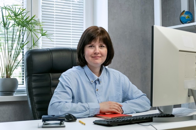 Portrait of woman company director in private office during work. Business woman.