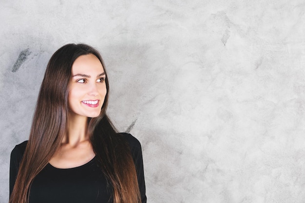 Portrait of woman on concrete background