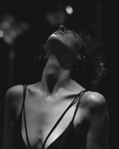 Portrait of a woman in a dark bar