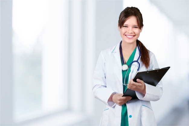 Portrait of woman doctor at hospital corridor