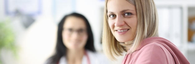 Portrait of woman and doctor in medical office ambulance 