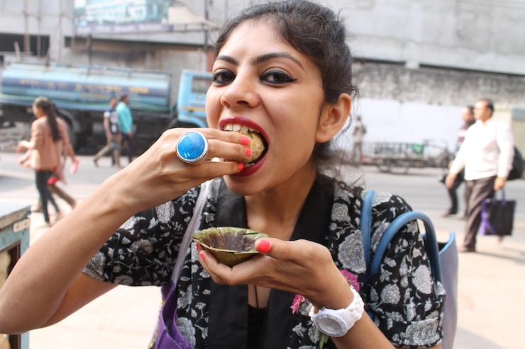 फोटो portrait of woman eating water ball
