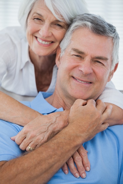 Portrait of woman embracing husband 