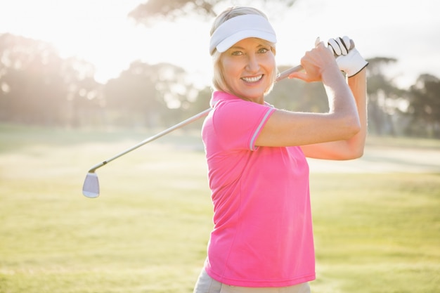 Portrait of woman golfer smiling