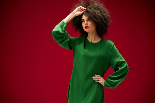 Photo portrait of a woman in a green afro dress hairstyle closeup