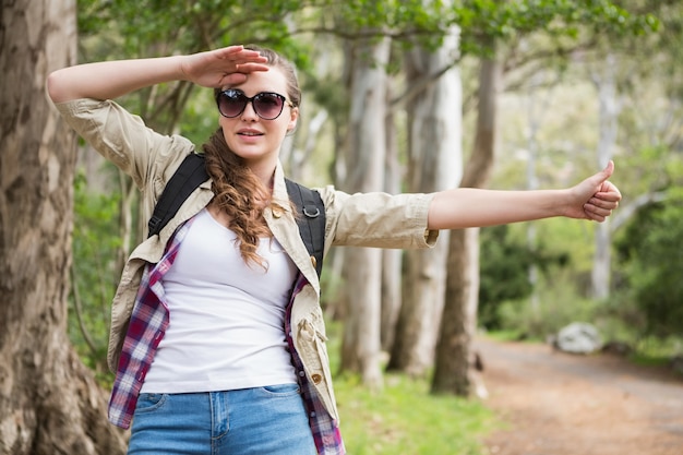 Portrait of woman hitch hiking