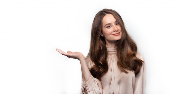 Portrait of a woman holding her hand up