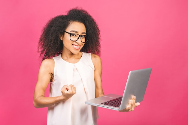 Portrait woman holding laptop