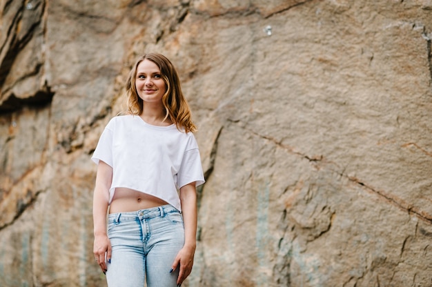 Portrait of a woman in jeans and a white T-shirt