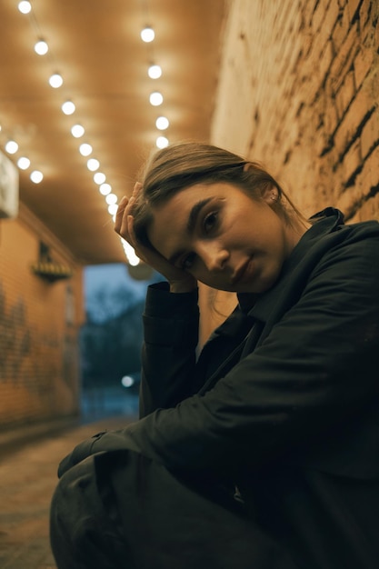 Portrait of a woman in a lanternlit alley late in the evening