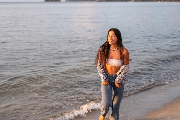 Portrait of a woman laughing happily at the beach