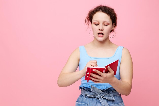 Portrait of a woman learning with notebook and pen closeup unaltered