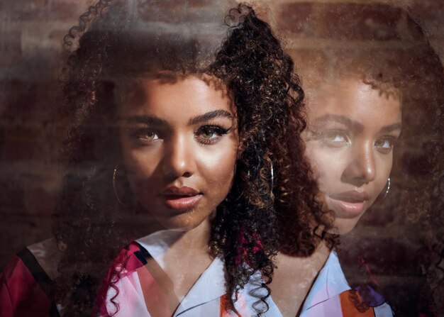 Photo portrait of a woman looking away double exposure