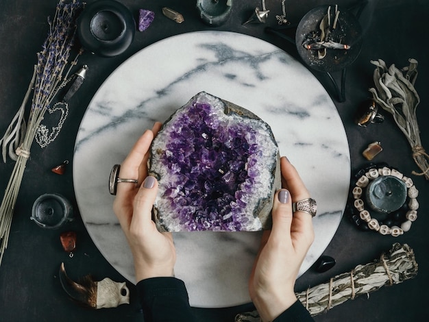 portrait of woman looking through magnifying glass