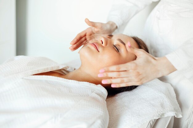 Portrait of woman lying on bed