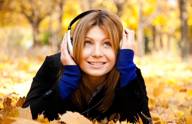 Portrait of a woman at outdoor with headphones