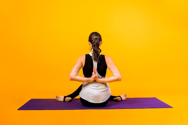 portrait woman performs yoga exercises