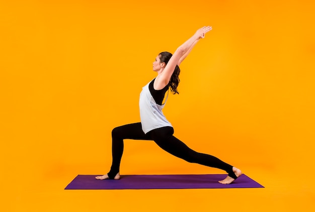 portrait woman performs yoga exercises