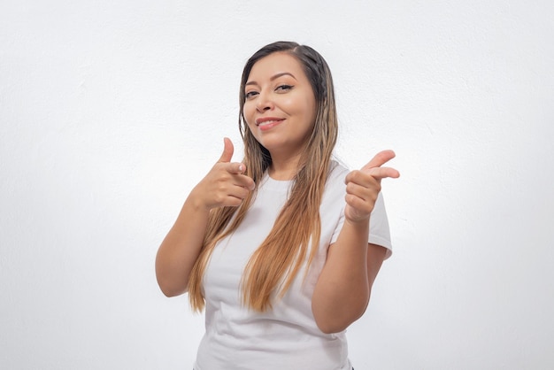 Portrait of a woman pointing in one direction Person pointing their fingers to a site Acceptance