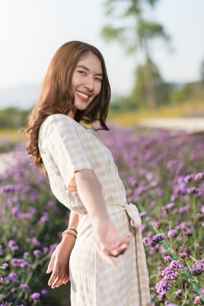 Portrait of woman posing in the flower garden